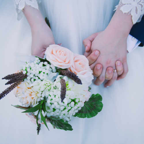 Suffolk Wedding DJ Reviews | Bride holding Bouquet