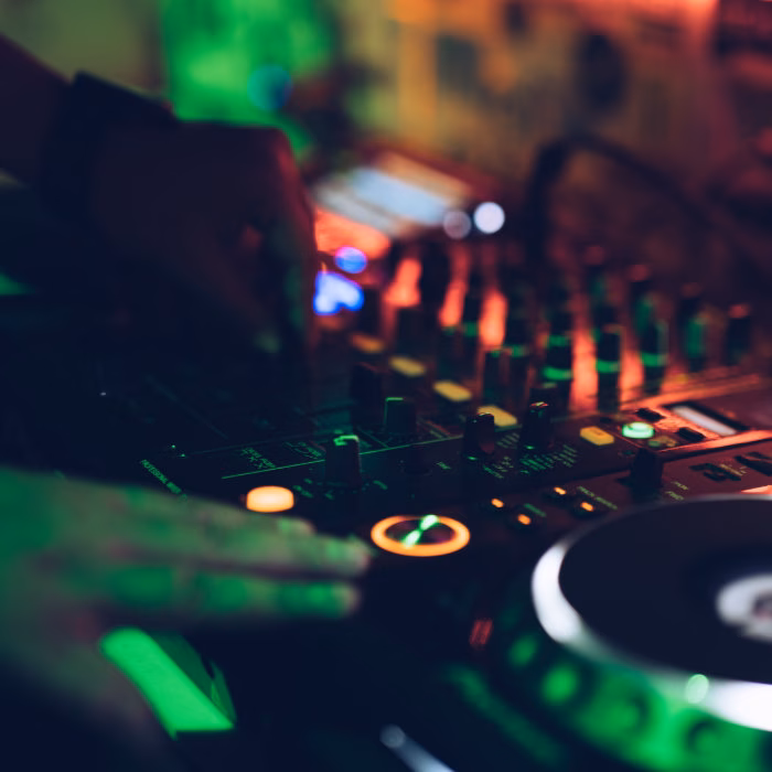 Close-up of a professional wedding DJ controller and mixer in action